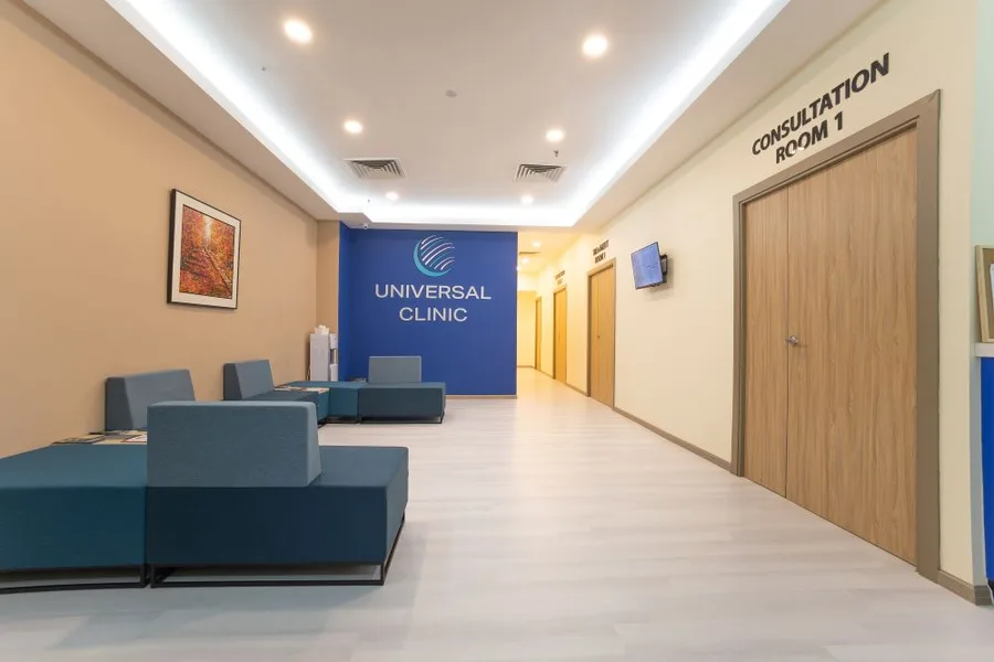 Corridor and consultation room at Universal Clinic